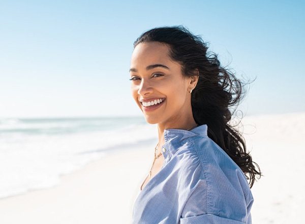 Lady smiles on beach