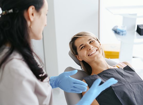 Patient and dentist talking during consultation