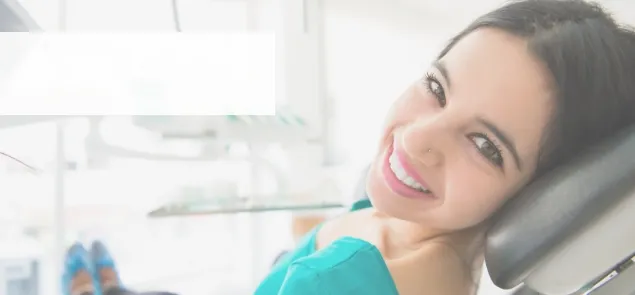 Young woman smiling in dental chair