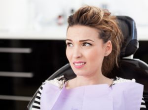 woman learning about smoking and dental implants