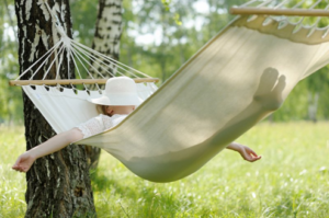 Woman relaxing in a hammock 